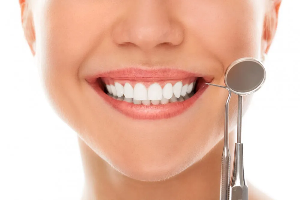 Dentist holding dental tools