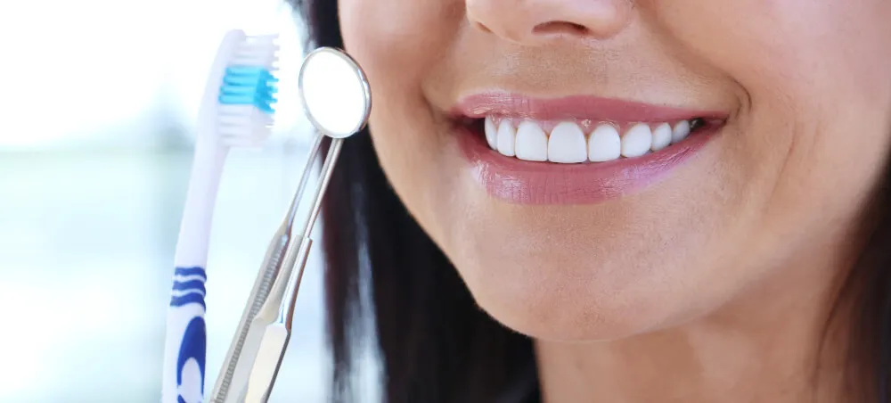 Dentist holding dental tools